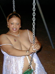 Fat chocolate woman posing outdoor